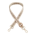 Close-up of ethnic style woven bag strap with geometric patterns and gold metal buckles - Beige Pink Green