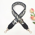 Detail of bohemian jacquard bag strap with white green leaves and golden hardware - Black Bean Green + Black Leather