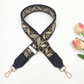 Close-up of ethnic jacquard strap with leaf embroidery and gold swivel metal hooks - Black Khaki + Black Leather