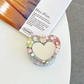 Macro shot of heart-shaped phone grip with fruit slices in resin and mirror detail - Pearl Brown