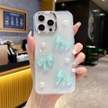 Detail of iPhone case with mint green bows, pearls, and silver plated camera frame - iPhone 7/8/SE 2020 / Green