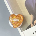 Macro shot of glitter heart phone grip with orange gradient and handmade label - Magnetic Colorful Sequin Heart Style No.15