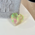 Macro shot of a laser heart phone grip with iridescent gradient and faceted crystal cuts - Adhesive Grip / Phantom Yellow