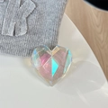 Close-up of a 3D holographic heart phone grip with faceted surfaces and a transparent base - Adhesive Grip / Iridescent Transparent