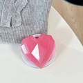 Detail of pink 3D heart faceted phone grip with transparent resin finish and expandable base - Magnetic / Iridescent Rose Red