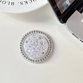 Close-up of a round phone grip featuring colorful glitter and a sparkling rhinestone border - Magnetic - White Rhinestone - Starry Sequins - Round - Dazzling White