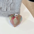 Macro shot of 3D iridescent laser heart phone grip with faceted crystal design - Magnetic / Laser Brown