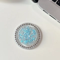 Macro shot of phone grip with blue glitter sequins and a rhinestone outer ring - Magnetic - White Rhinestone - Starry Sequins - Round - Blue