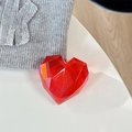 Detail of red 3D faceted crystal heart phone grip on white surface with knit texture - Adhesive Grip / Laser Ankara Red
