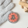 Detail of orange bear phone grip featuring sparkling rhinestones on a knitted backdrop - Orange (Jelly Bear Mirror / White Zirconia)