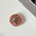 Close-up of pink glitter phone grip with heart mirror and mine. text on a white desk - Transparent Stand - Colorful Sequins Heart Mirror - No. 12