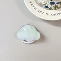 Detailed view of iridescent cloud phone grip with gradient pearlescent finish - Magnetic Cloud / White
