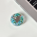 Detail of a sparkling heart mirror phone grip with blue glitter and 'mine.' text - Transparent Stand - Colorful Sequins Heart Mirror - No. 3