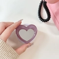 Macro detail of purple heart phone grip with built-in mirror and transparent resin edges - Mauve