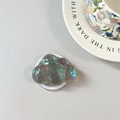 Macro detail of cloud-shaped laser iridescent phone socket with metallic aurora finish - Magnetic Cloud / Black