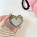 Detail of heart-shaped phone grip with green marble texture and integrated mini mirror - Dark Green