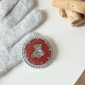 Close-up of red bear phone grip with rhinestones on a warm knitted glove background - Brown (Jelly Bear Mirror / White Zirconia)