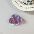 Close-up of holographic cloud phone grip with iridescent purple finish and stable pop socket - Magnetic Cloud / Purple