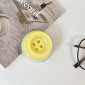 Minimalist candy yellow button phone stand shown with stylish glasses and magazine lifestyle setup - Magnetic Large Button / Crystal Solid Color-Dark Yellow