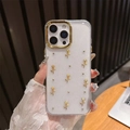 Detalle de funda iPhone con rosas doradas 3D, acabado brillante y protección de cámara - Círculo Dorado-Pegamento de Gota de Purpurina-Rosa de Perla Dorada / iPhone 17 Pro Max