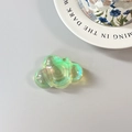 Detailed view of iridescent laser cloud phone stand with glossy holographic finish - Adhesive Cloud / Green