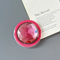 Macro shot of a round phone socket featuring a faceted pink crystal gemstone with sparkles - Magnetic-Large Round Rhinestone-Rose Red