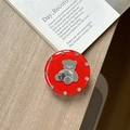 Detail showing red round bear phone grip with rhinestones on a wooden desk setup - Transparent Stand - Jelly Bear Mirror - Red