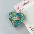 Detail of blue heart phone grip with colorful sequins and handmade metal plate - Style 3