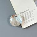 Detail of a luxury multi-faceted magnetic phone grip with iridescent AB crystal coating - Adhesive-Large Round Rhinestone-White