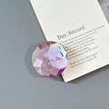 Close-up of a faceted purple crystal phone socket mount with luxury light refraction - Adhesive-Large Round Rhinestone-Purple