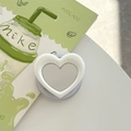 Close-up of a white heart-shaped vanity mirror phone socket on an aesthetic background - White