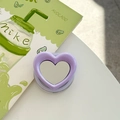 Detail of purple heart-shaped magnetic phone grip with a built-in makeup mirror on a white desk - Light Purple