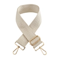Detail of cream herringbone fabric bag strap with adjustable gold metal hardware buckles - Off White