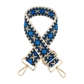 Close-up of adjustable wide woven shoulder strap with blue geometric pattern and gold clips - Black & Royal Blue
