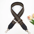 Detail of adjustable bohemian jacquard strap with geometric pattern and gold swivel hooks - Gold Buckle / Black Base Brown Gold Thread + Black Leather