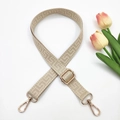 Adjustable beige maze pattern woven shoulder strap with gold metal hooks on white background - Solid Beige