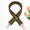 Close-up of bohemian woven wide shoulder strap with golden metal lobster clasps - Black with Yellow Floral