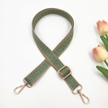 Detail of adjustable woven bag strap with green geometric patterns and gold metal hooks - Green and Khaki Edge