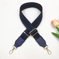 Detail of adjustable embroidered bag strap with floral jacquard and golden metal hooks - Black Base Blue + Blue