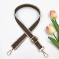 Detail of adjustable geometric pattern shoulder strap with gold metal hardware on white background - Dark Khaki and Beige Edge