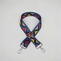 Detail of bohemian style woven bag strap with colorful geometric pattern and silver hooks - Film Strip Silver Buckle