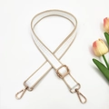 Detail of adjustable maze pattern bag strap with golden metal lobster clasps - White and Khaki Edge