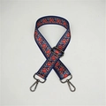 Detailed close-up of retro ethnic pattern bag strap with gunmetal lobster clasps - Dandelion Gunmetal Buckle