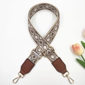 Detail of embroidered geometric bag strap with brown leather ends and gold metal clips - Gold Buckle / Beige Brown Coffee + Brown Leather