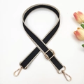 Detail of adjustable 2.5cm woven bag strap with golden lobster clasps and geometric pattern - Black and Beige Edge