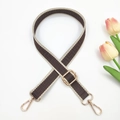 Close-up of adjustable woven shoulder strap with geometric pattern and gold metal hooks - Coffee and Beige Edge