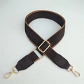 Detailed view of adjustable wide shoulder strap with golden metal lobster clasps and buckles - Coffee 2