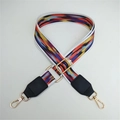 Detail showing the colorful abstract stripes and golden metal clasps of the bag strap - White Border Colorful Clouds With Black Leather End