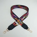 Macro shot of ethnic style colorful woven handbag strap with golden metal swivel hooks - Black Border Colorful Clouds With Black Leather End
