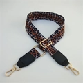 Detail of adjustable leopard print bag strap with gold metal hooks and black leather ends - Leopard + Black Leather